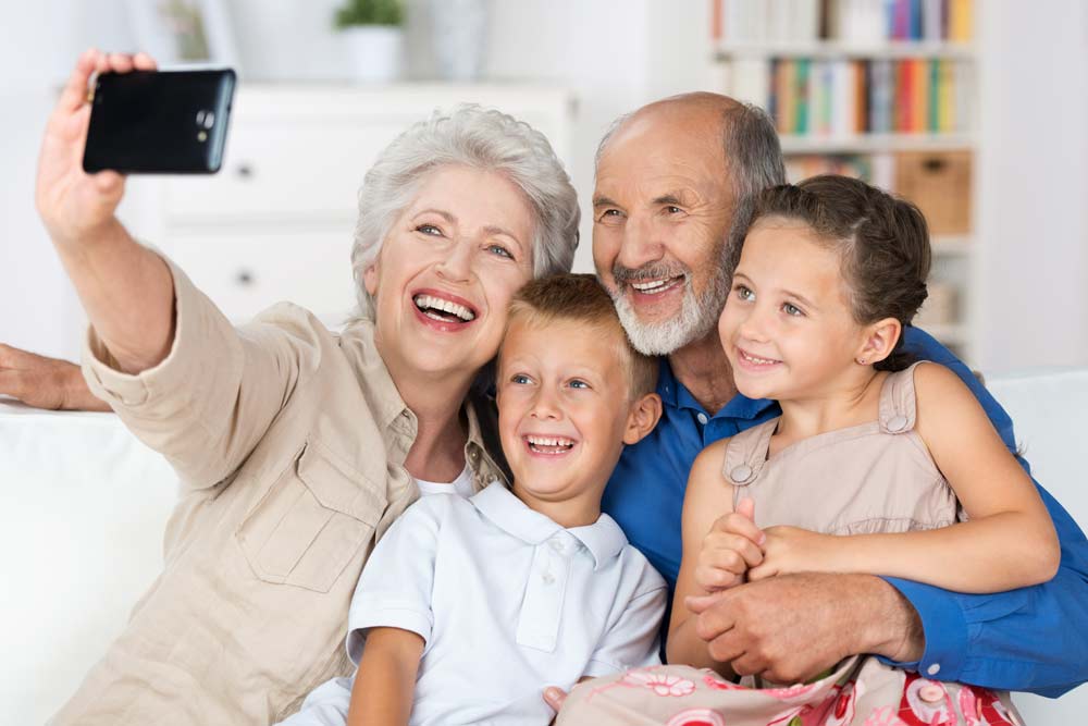 grandparents and kids taking a selfie together